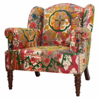 dhola patchwork accent chair angled view showing sculpted arms and layered upholstery