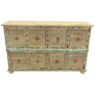 Front view of eight-drawer sideboard with repeated carved rosettes and ring pulls